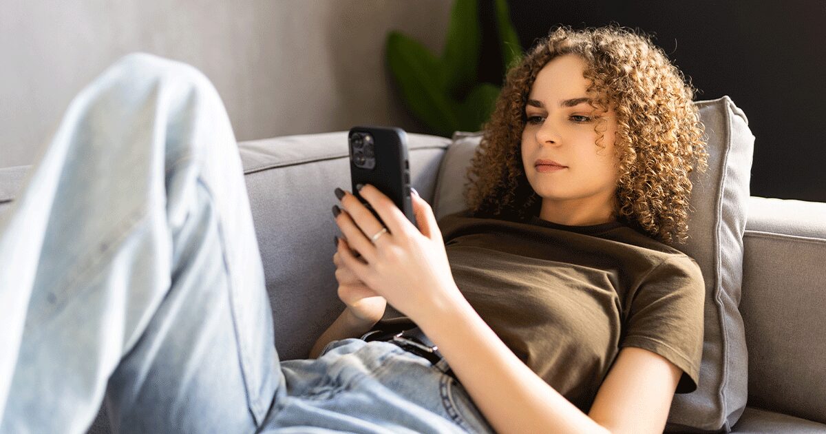 Woman researching information about human trafficking awareness and survivor support resources online