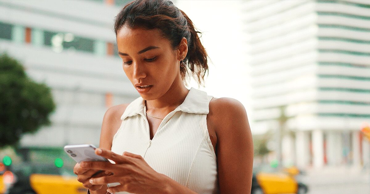 Woman using her smartphone to learn about human trafficking awareness and prevention